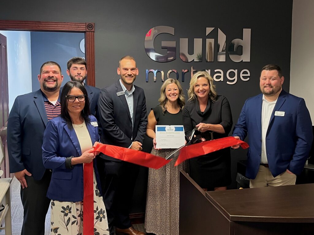 Seven people inside for a ribbon cutting