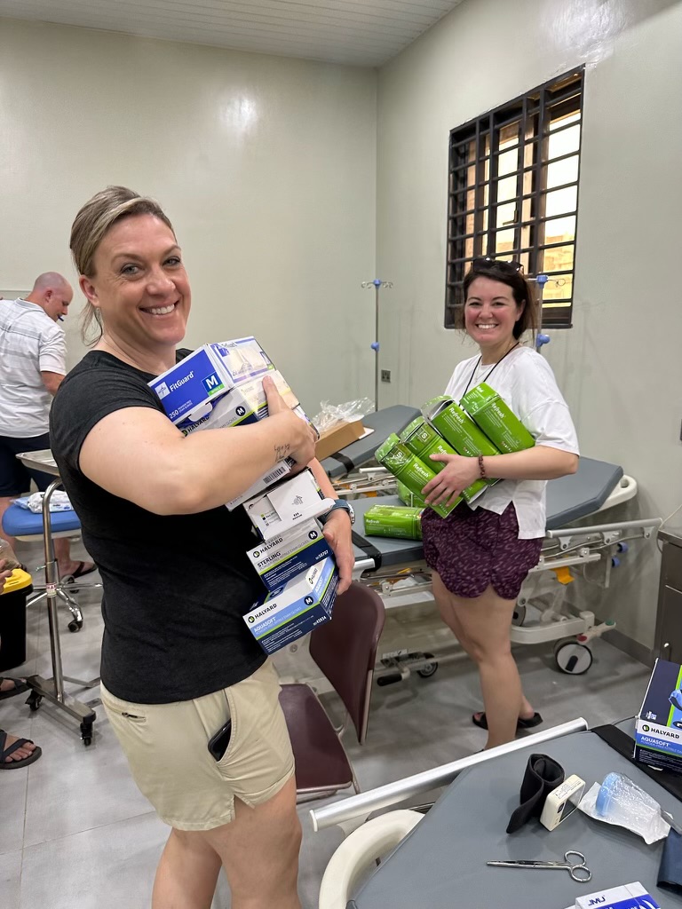 Two adults with medical equipment