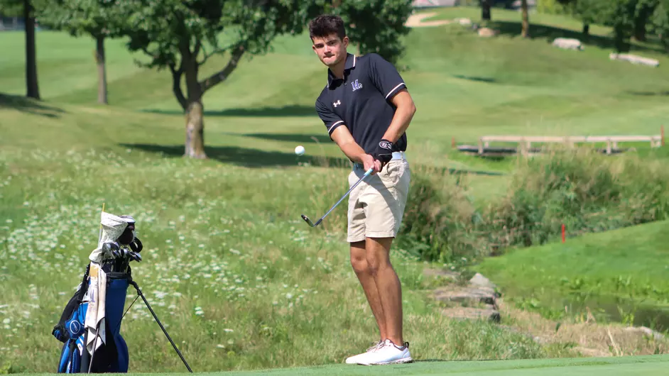 A man playing college golf