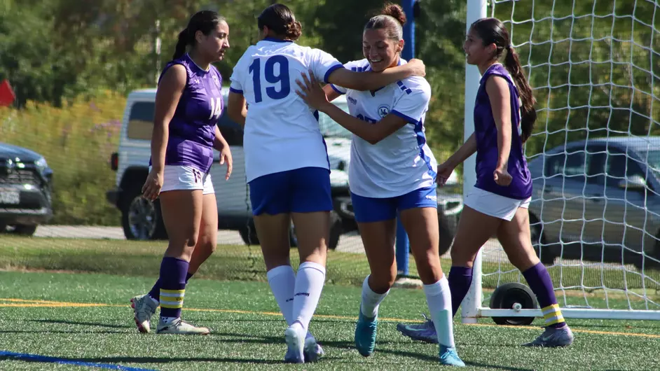 Women playing college soccer