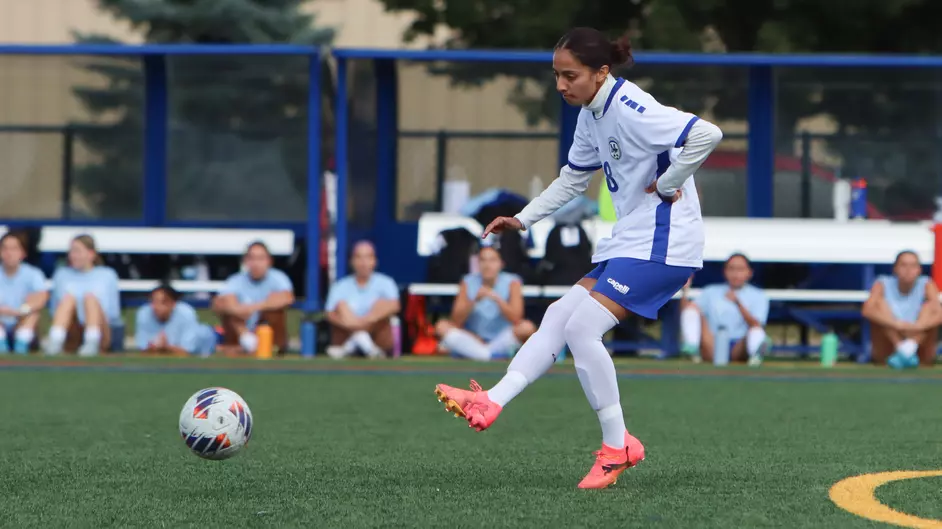 Women playing college soccer