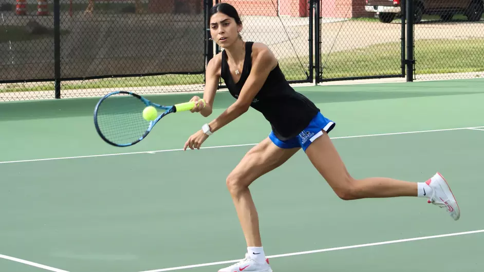 A woman playing tennis
