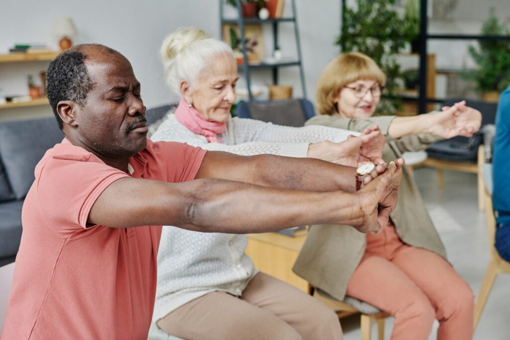 Three older people exercising