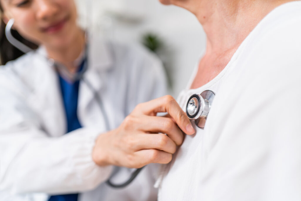 A doctor using a stethascope