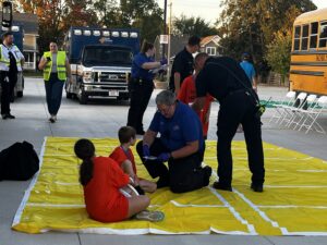 emergency personel helping children