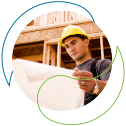 A man with plans wearing a hard hat