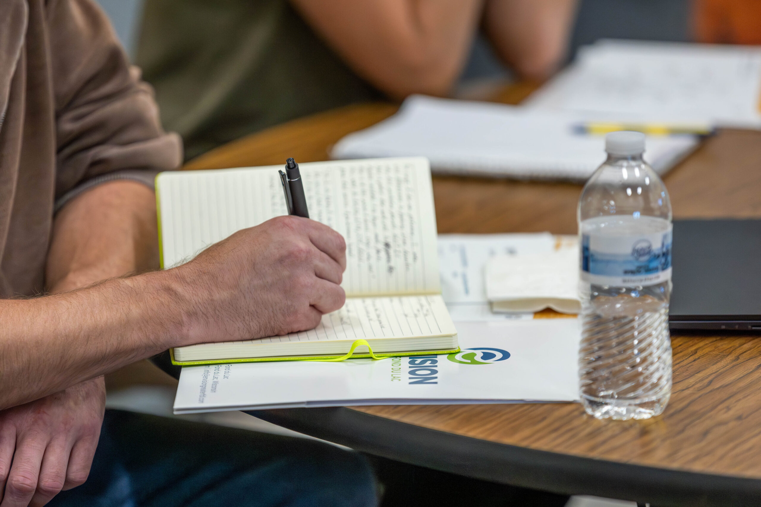 ignite-rural-2025-7 Someone's hands writing in a notebook