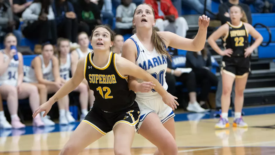 Women playing college basketball
