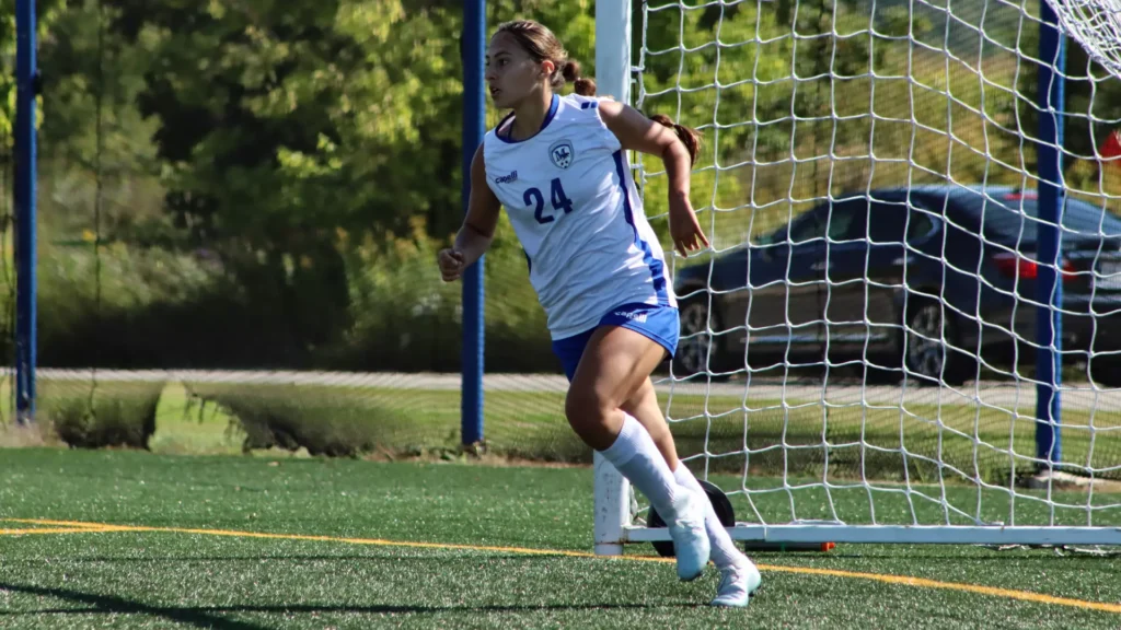 women playing college soccer