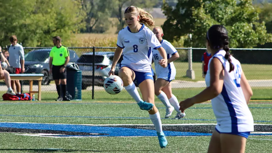 Women playing college soccer
