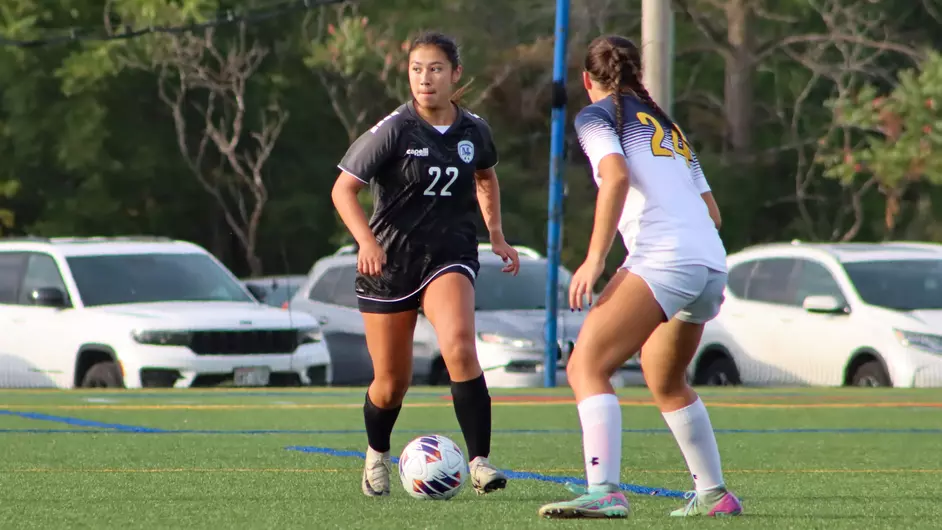 Women playing college soccer