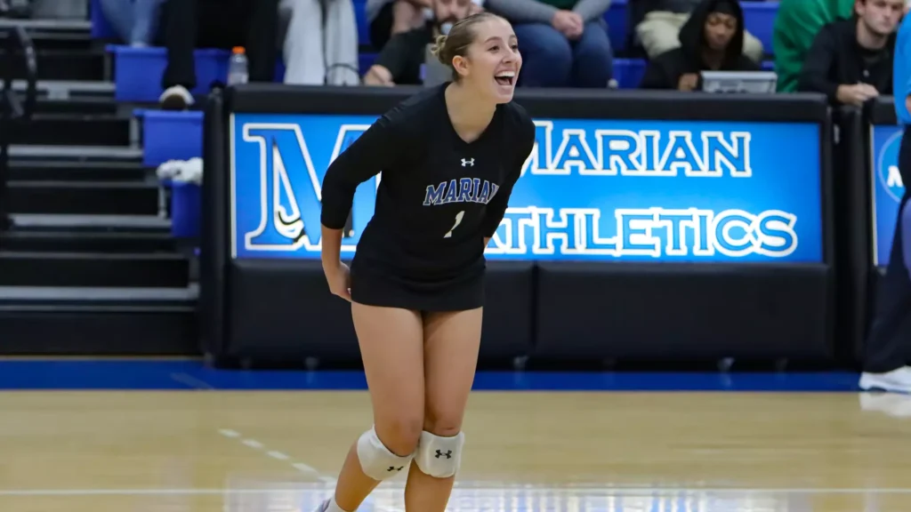 women playing college volleyball