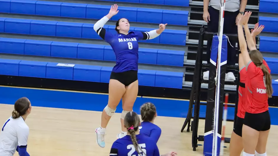 women playing college volleyball