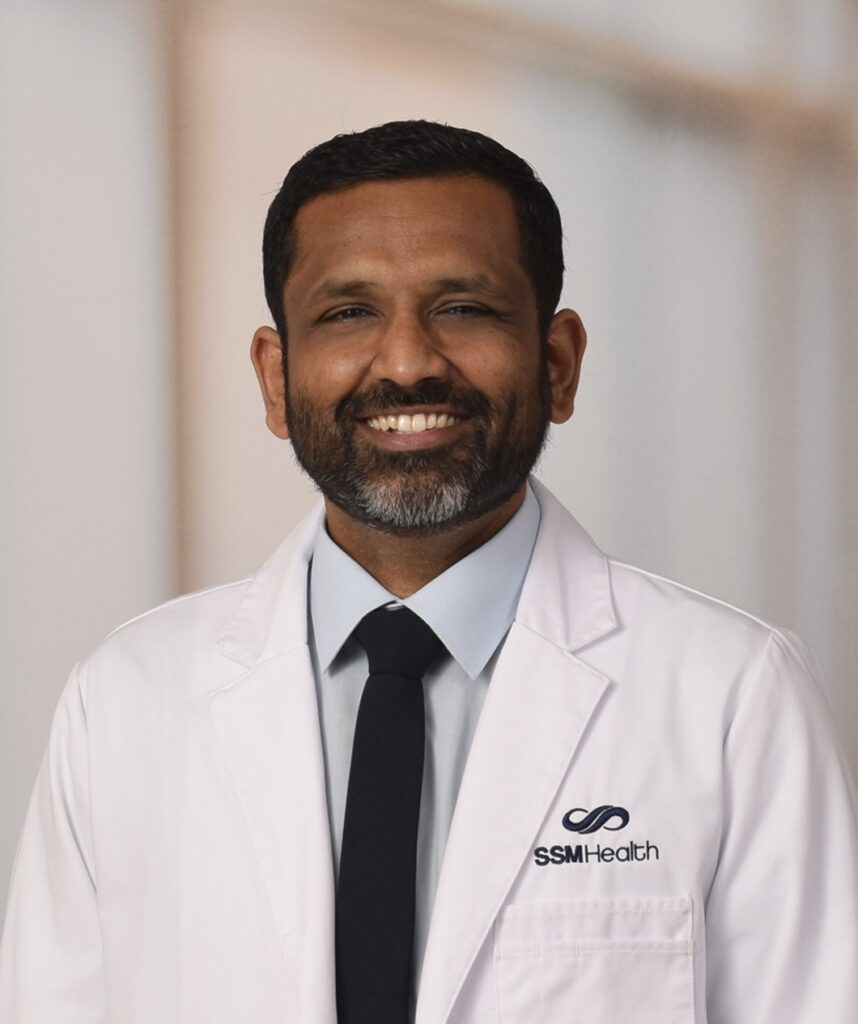 A smiling male doctor