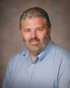 A man in a blue shirt