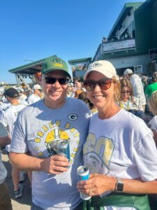 A man and a woman at a Packer game