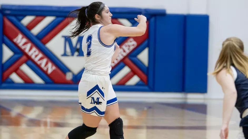 Women playing college basketball