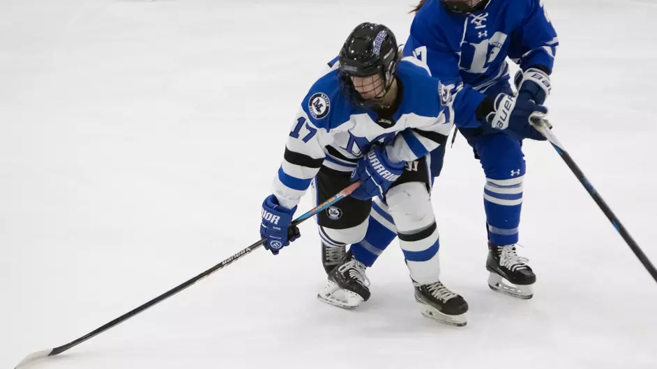 women playing college hockey
