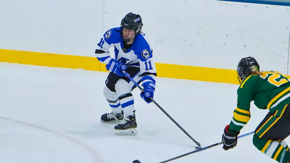 Women playing college hockey