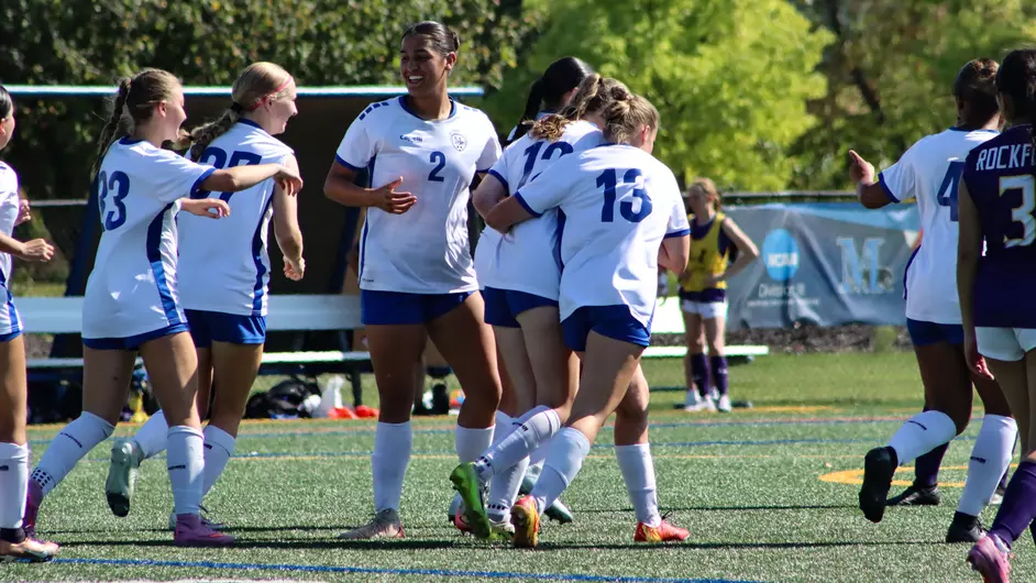 Women playing college soccer