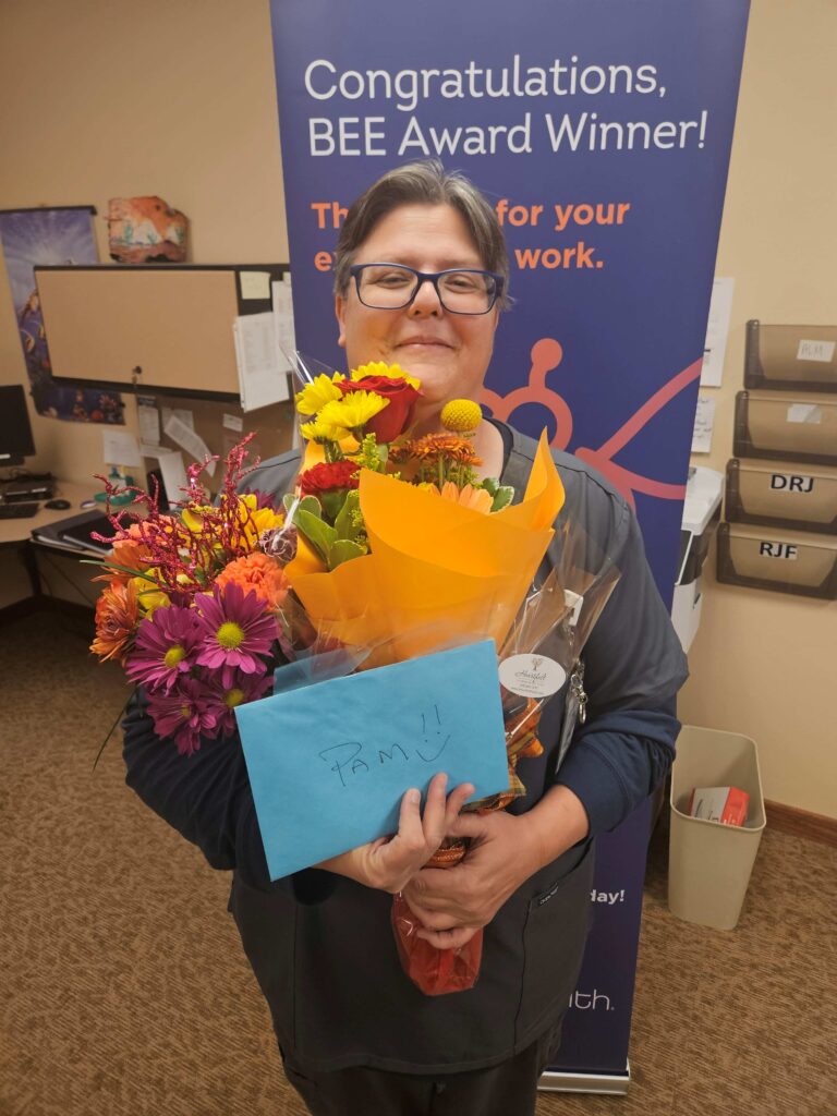 A woman holding a bouquet of flowers