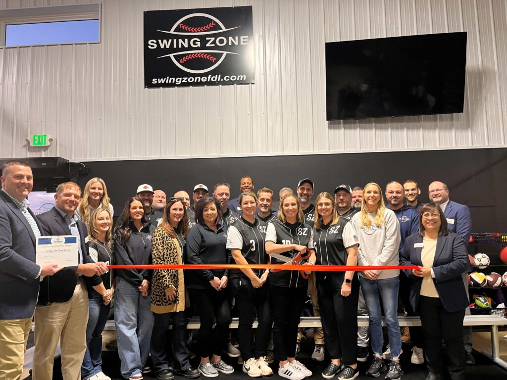 A large group inside for a ribbon cutting