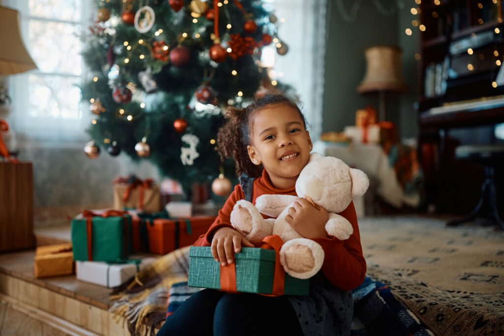 A little girl under a christmas tree