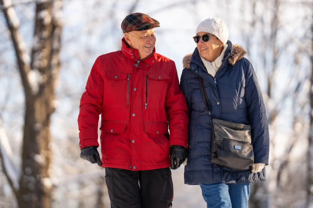 An older couple walking in the winter