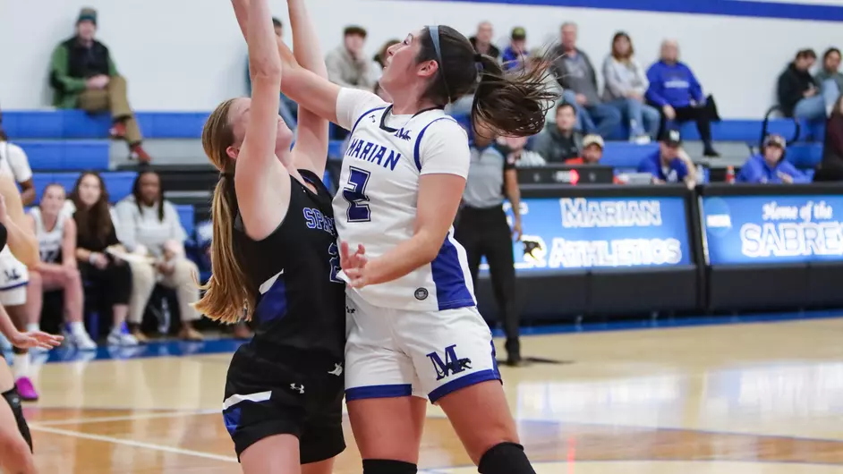 Women playing college basketball