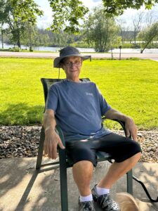 An older man in a lawn chair