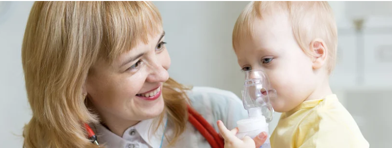 A woman and child with the child holding an oxygen mask