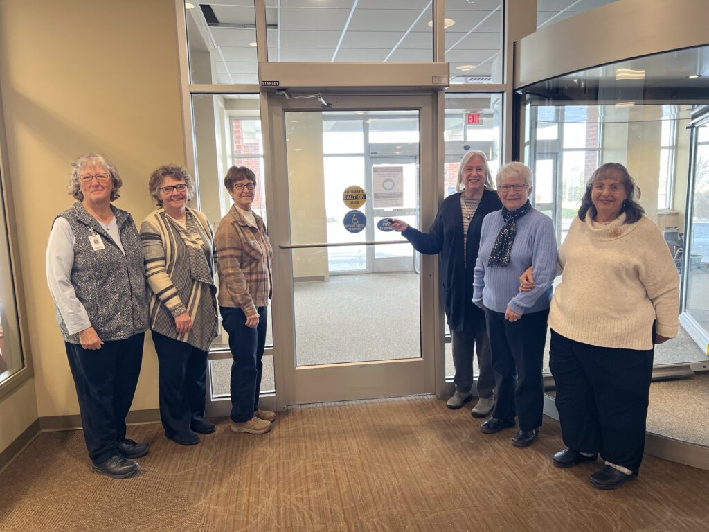 Six people by an outside door