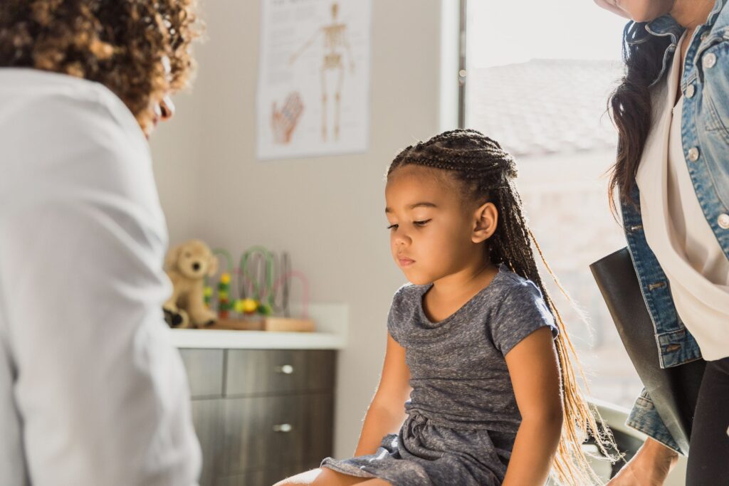 A little girl with a doctor