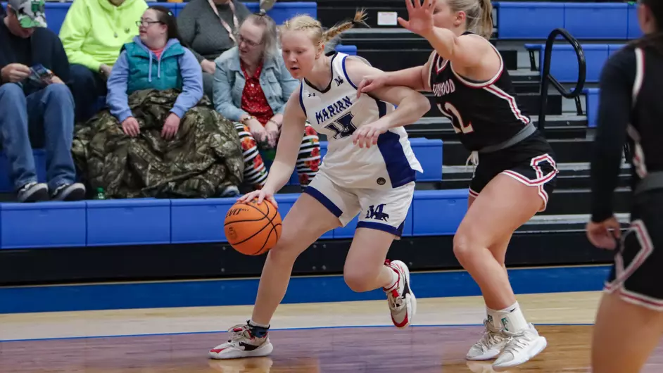 Women playing college basketball