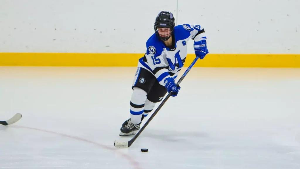 women playing college hockey