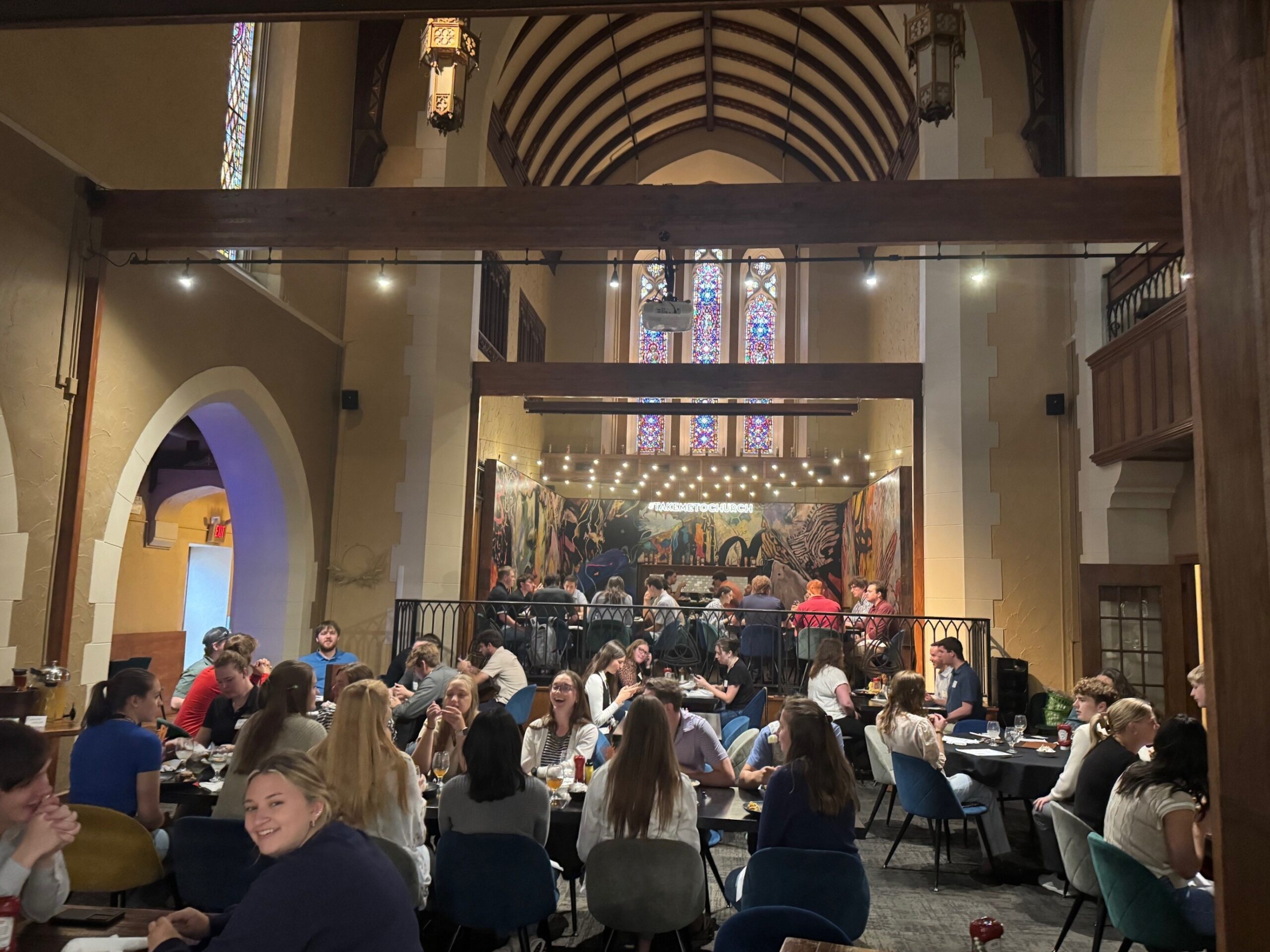 large group in a dining hall eating