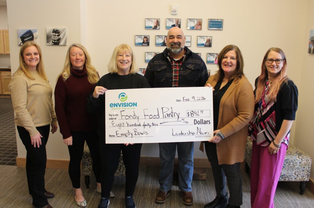 Six people receiving a big check