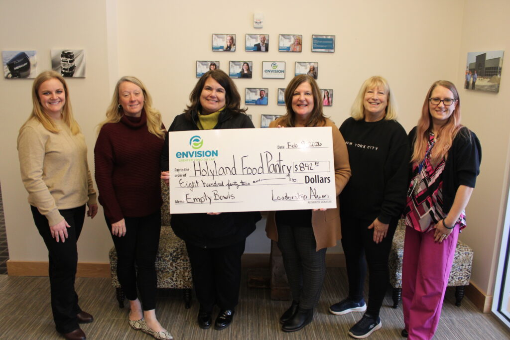 Six people receiving a big check