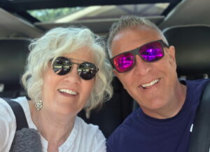 A smiling man and a woman