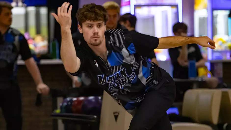 Men bowling for their college team