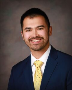 A man wearing a suit and tie