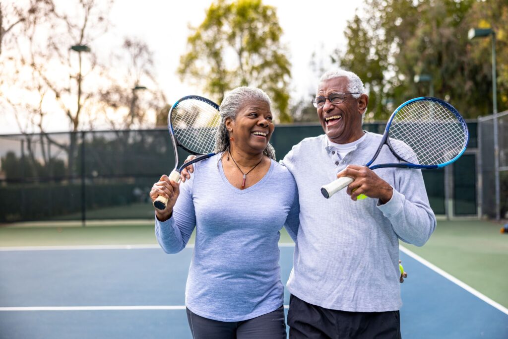 An older couple on a tennis court
