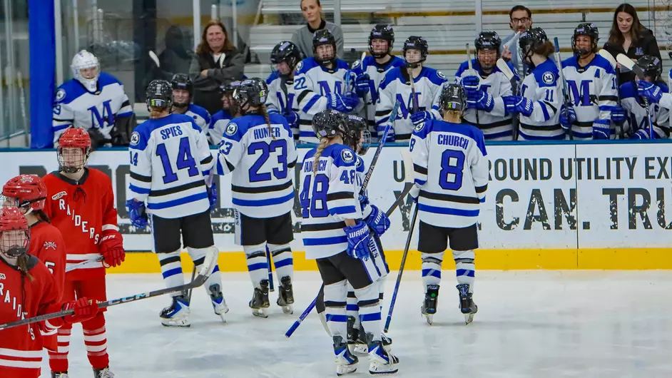 women playing college hockey