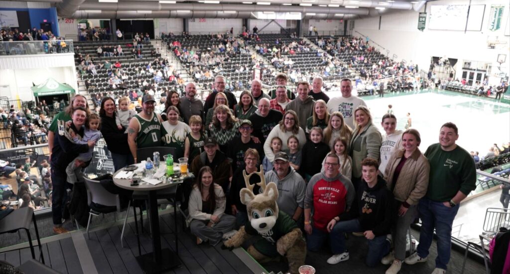 A large group at a basketball game