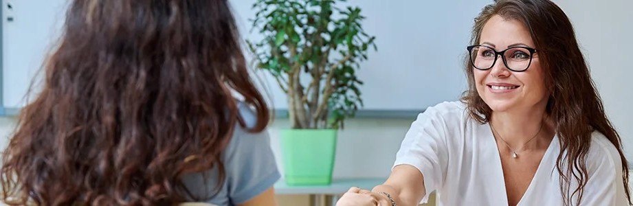 Two women sitting and talking