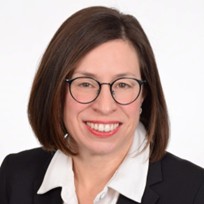 A smiling woman with glasses