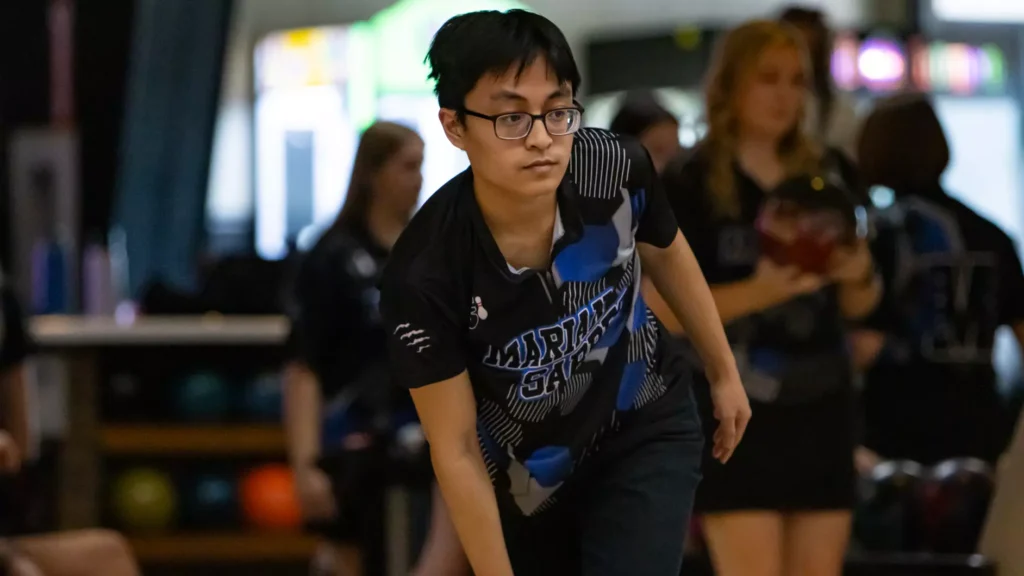 Men bowling for their college team