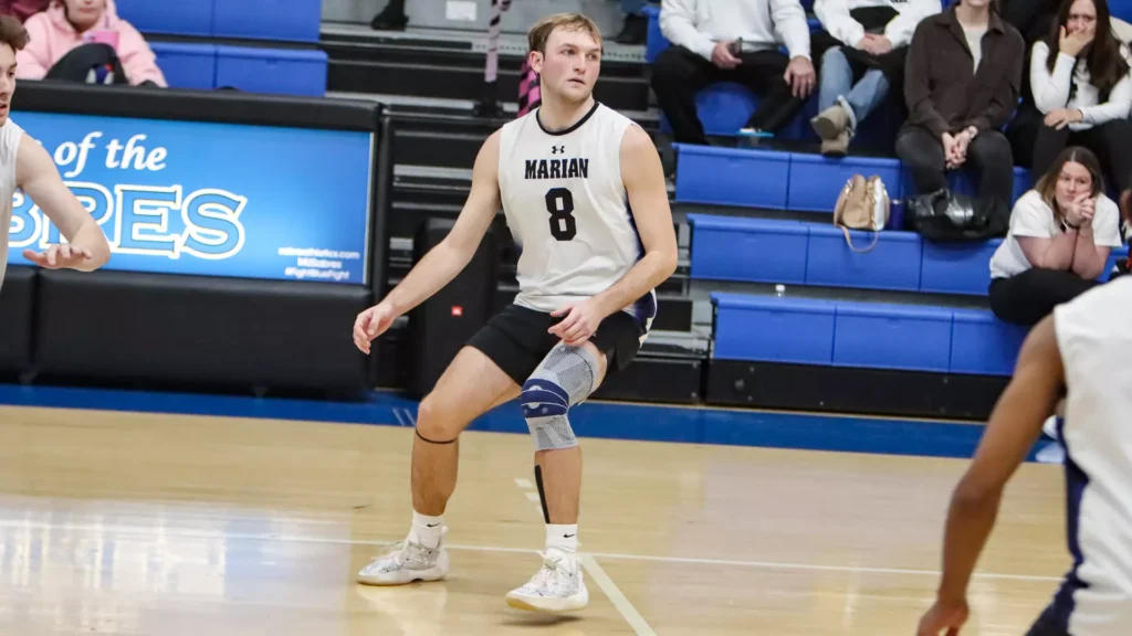 men playing college volleyball