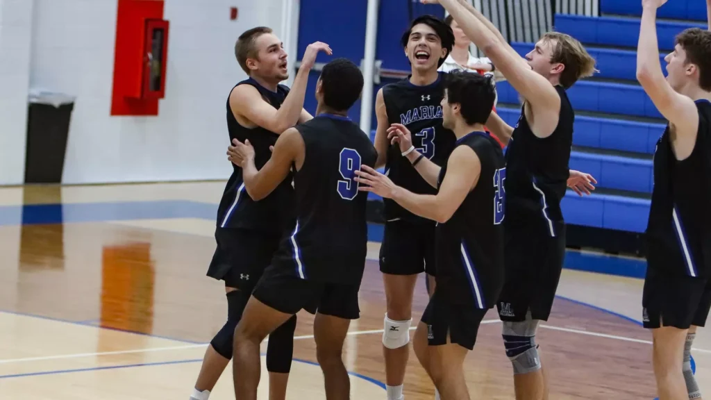 men playing college volleyball