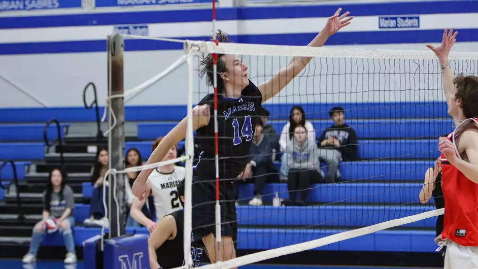 Men playing college volleyball
